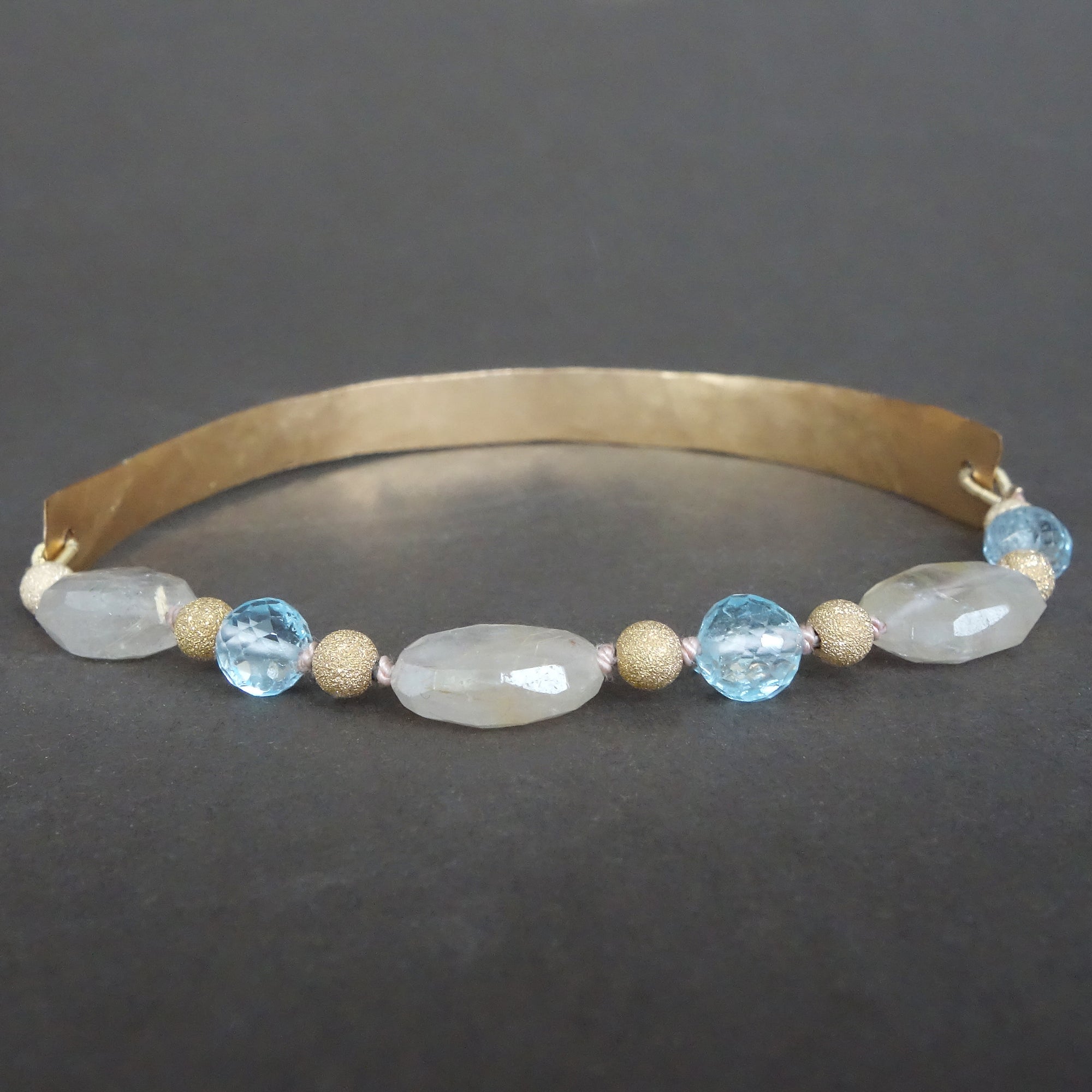 Bangle Me Beautiful (hand hammered gold and blue topaz bracelet)