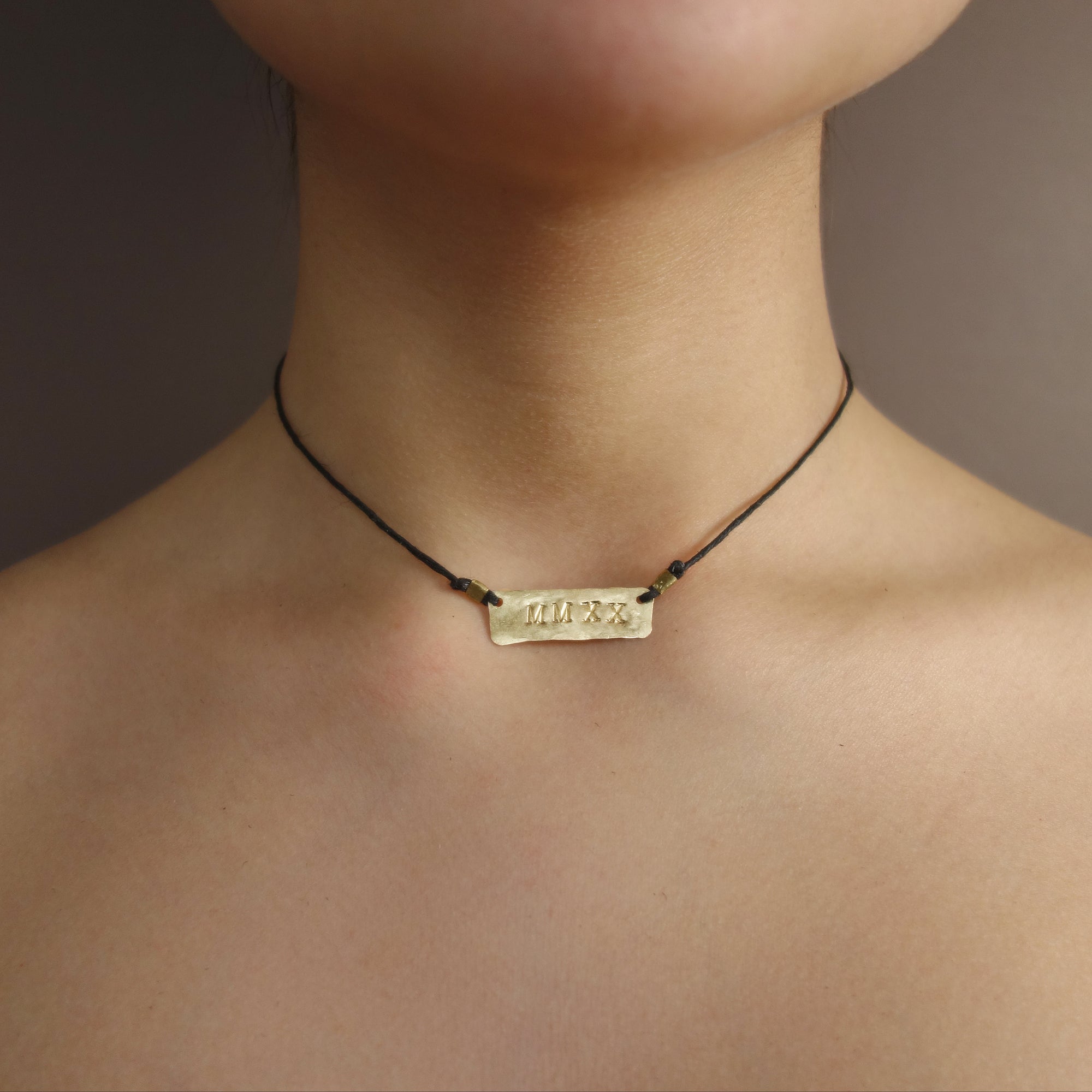 MMXXI: hand hammered gold on leather necklace/bracelet