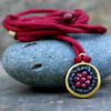 Ruby and iolite on silk