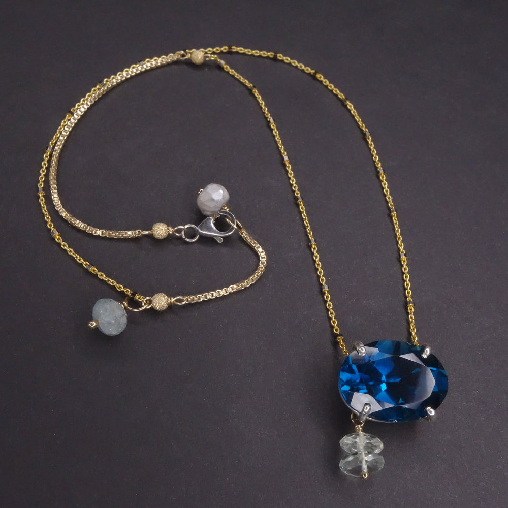 Here She Comes Just a Walkin' Down the Street: London blue topaz on gold